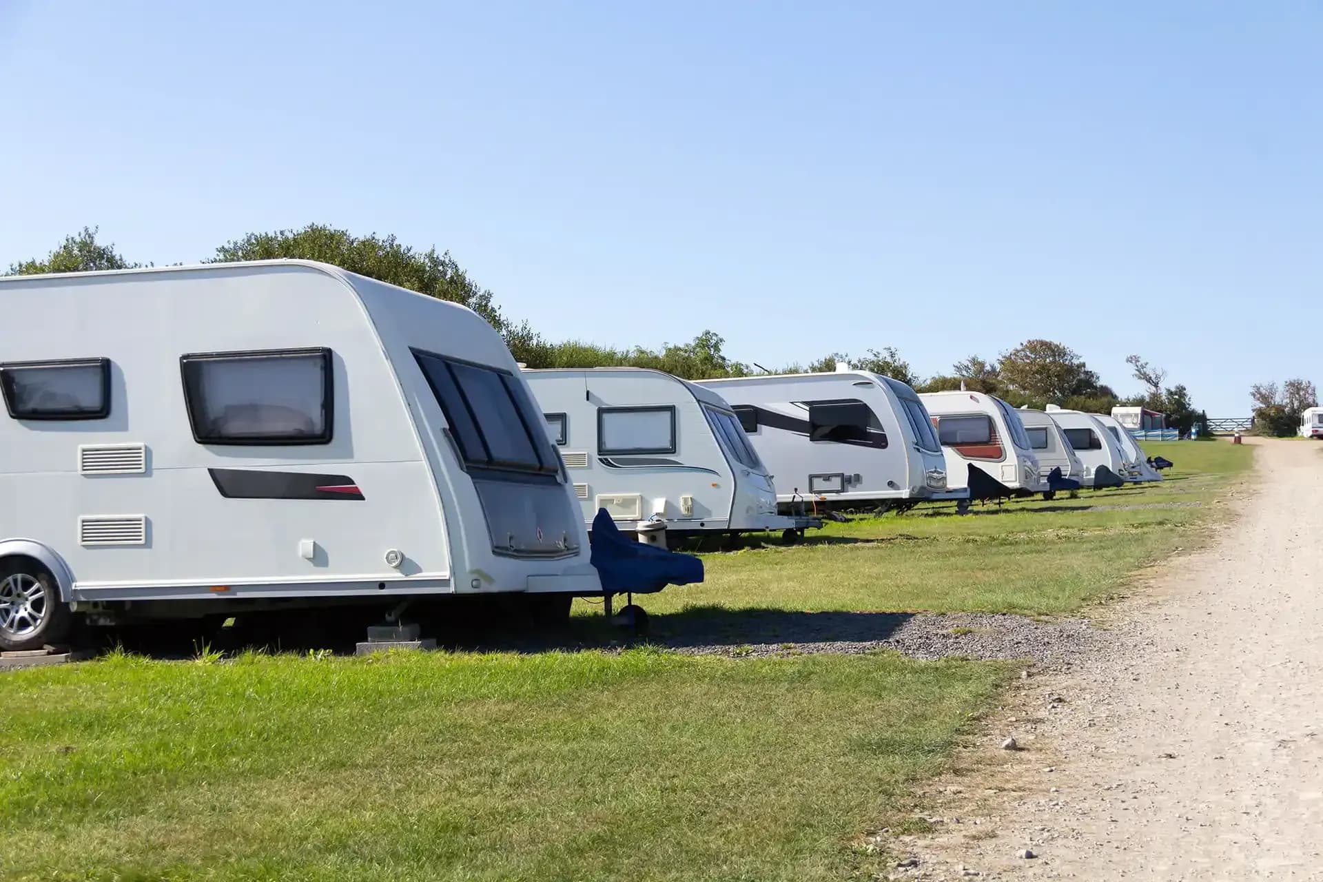 Rows of caravans and boats parked in Kennedy RV's secure storage yard